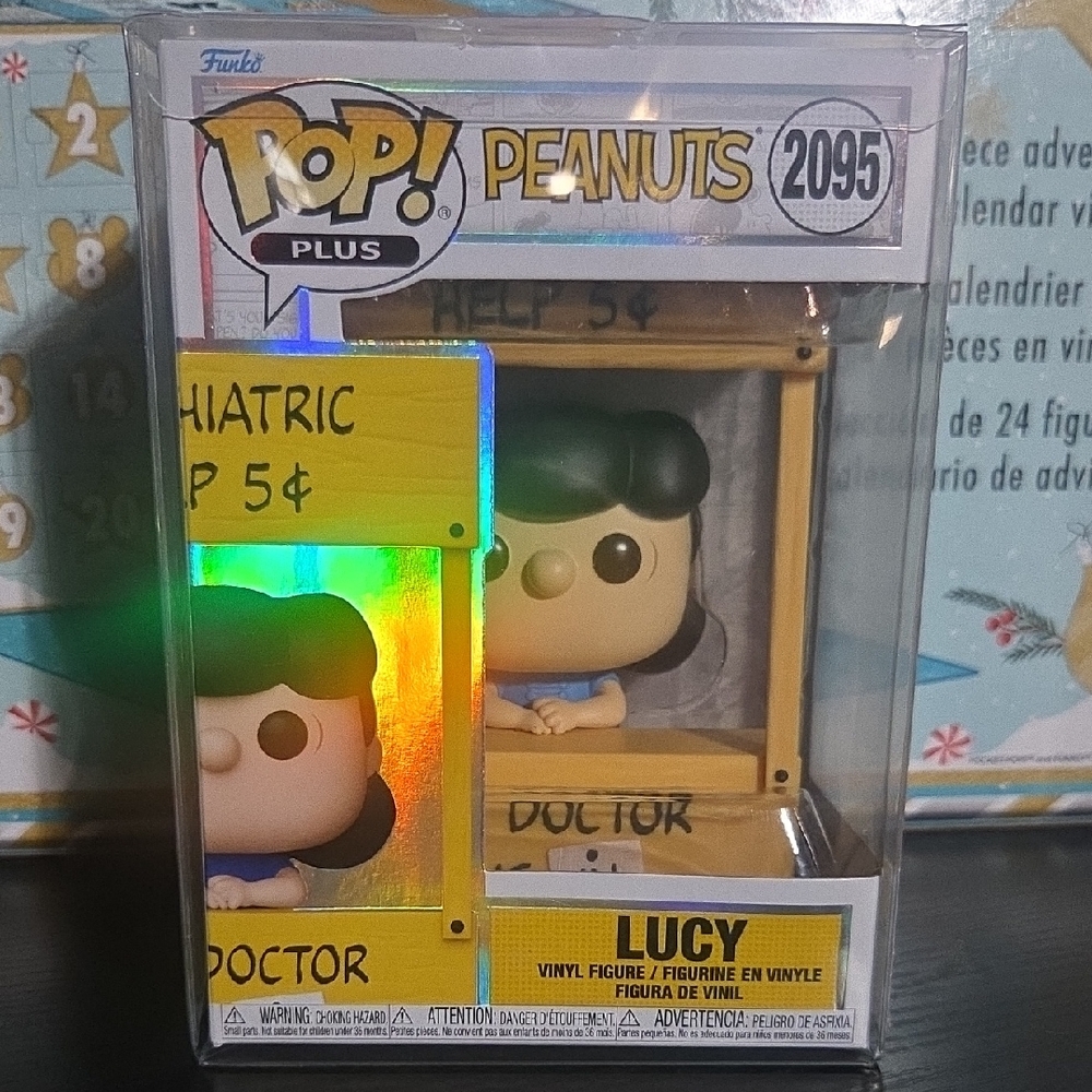 Funko Peanuts Lucy in Yellow Doctor Booth Vinyl Figure (Green Hair)